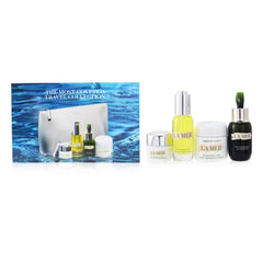 The Most-Covered Travel Collection: 1x The Concentrate - 30ml/1oz + 1x The Eye Balm Intense - 15ml/0.5oz + 1x The Renewal Oil - 30ml/1oz + 1x Cream De La Mer The Moisturizing Cream - 60ml/2oz + 1x Bag